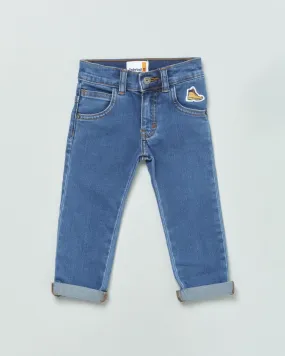 Jeans a gamba dritta in cotone stretch lavaggio medio stone washed con risvolti al fondo 9-18 mesi